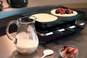 Swissmar KF-77040 Classic 8-Person Raclette Party Grill with Reversible Cast Iron Grill Plate/ Crepe Top, Black N8