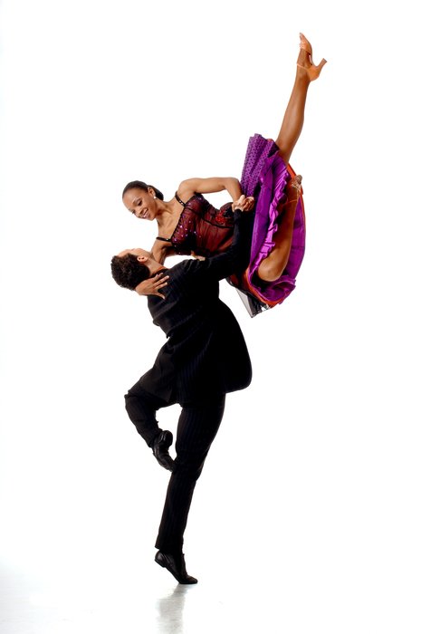 man throws up a girl in latin dance