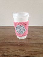 Crochet cup cozy, coffee cup sleeve, reusable coffee sleeve, coffee cup cozy in pink with a light grey flower N2