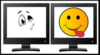 clipart of the Smiley Faces on a computer's monitors