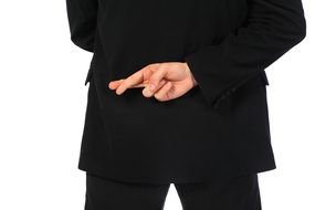 back view of male person with Crossed Fingers