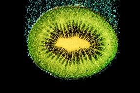 background with slice of kiwi in beverage