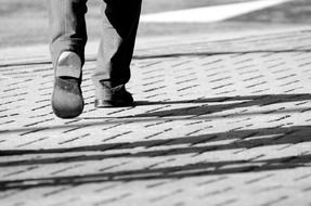 walking businessman on pavement