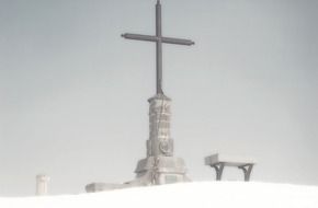 cross at matagalls snowy mountain