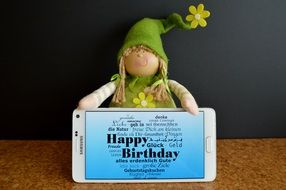 blue birthday greeting card on the smartphone display