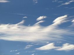 contrail in the clouds