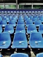 central blue seats in the stands of the stadium