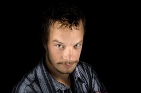 portrait of a man on a black background