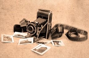old camera with film and vintage pictures