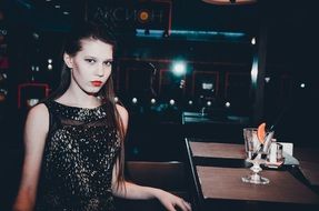 young model posing in the bar