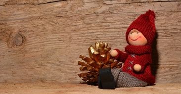 knitted toy and pine cone