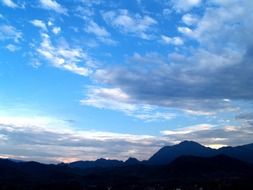 blue sky mountains white clouds