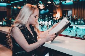 young model with long curly hair in a bar