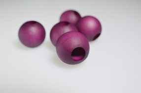 purple wood beads white background