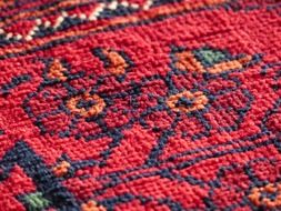 red wool carpet flower pattern