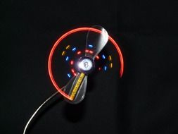 multicolored fan on a black background