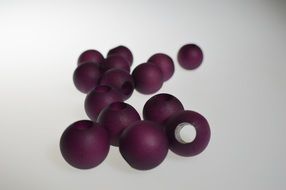 purple beads on a white background