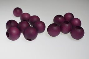 isolated purple wooden beads