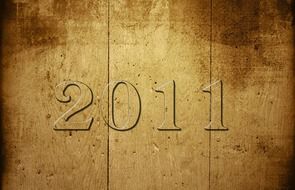number 2011 on a wooden background