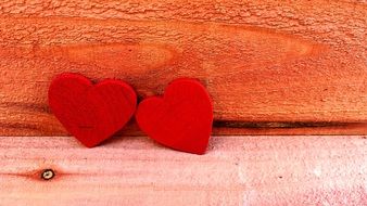 two red wooden hearts