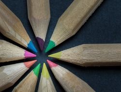 wooden colored crayons in a circle