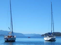 sailboat water mountain nature sky