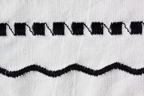 black embroidery of sewing machine white background