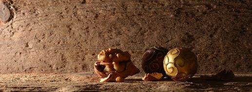 walnut and two Christmas balls