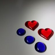 two red glass hearts