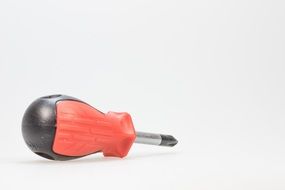 isolated screwdriver with red handle