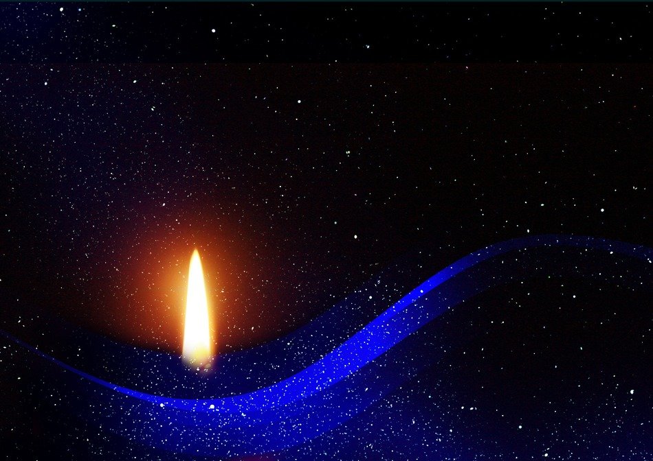 Christmas candle on a black and blue background