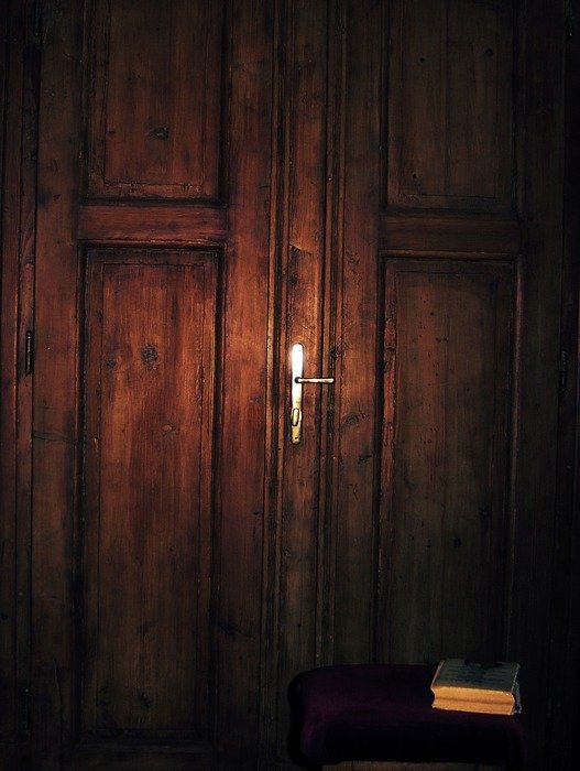 wooden door entrance inside light