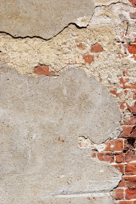 wall plaster ripped weathered