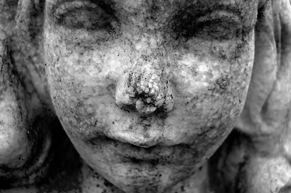 statue child girl stone texture