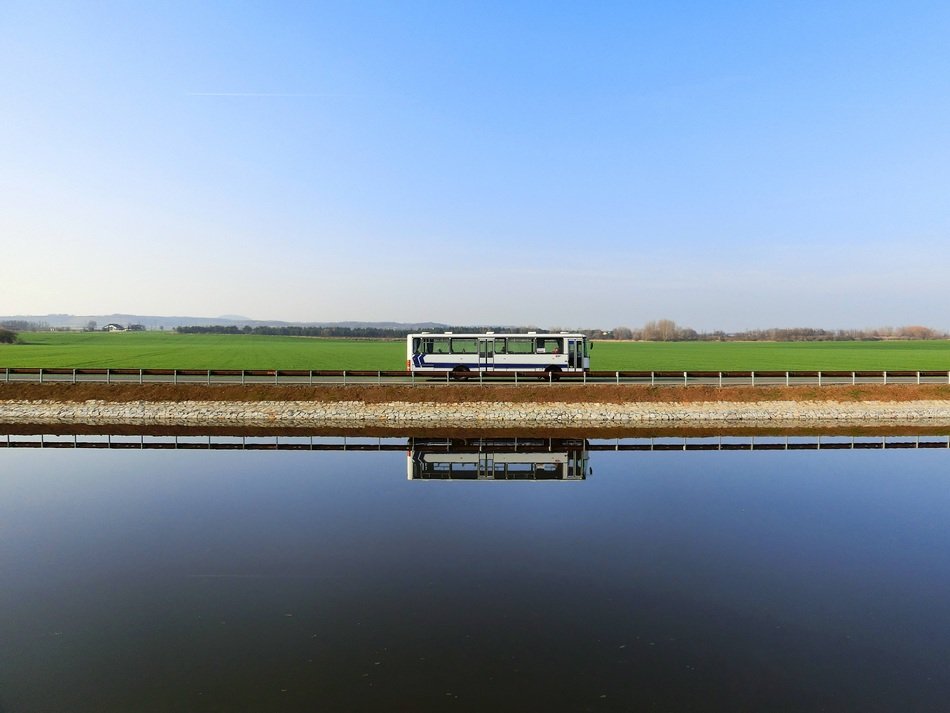 bus riverside sky mirroring