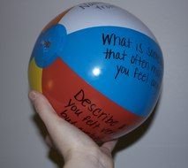 Beach Ball with writings on hand