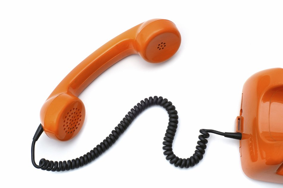 orange receiver of desk Phone with black cord