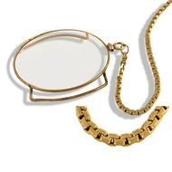photo of a monocle on a gold chain