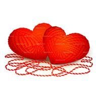 drawn two red balls of wool in the shape of hearts