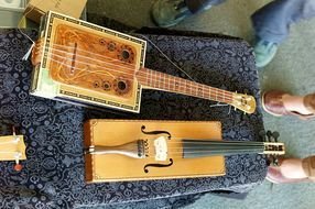 two square guitars on the table
