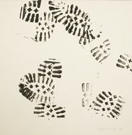 Black footprints from the boots on the ground