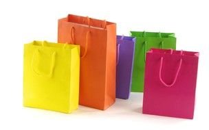 five multi-colored gift bags