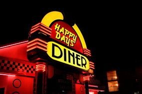 Happy Days diner, Neon Sign above entrance door at night