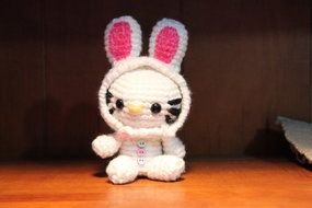knitted white rabbit on the table