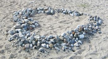 stones on the beach in the shape of a heart