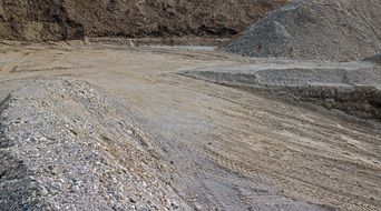 background grey sand stones pit