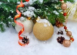 background with decorative Christmas balls on snow