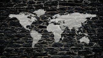 gray map of the world on a black background