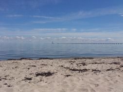 beach sea water sand sky bridge