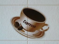 cup of coffee on a white tile
